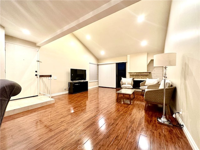 living room featuring high vaulted ceiling and wood-type flooring