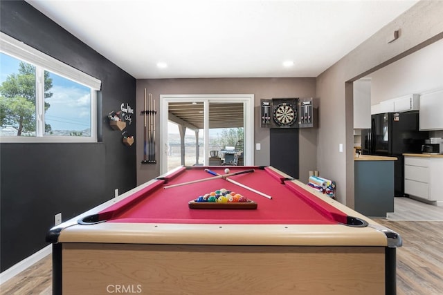 recreation room with pool table, light wood-type flooring, and a healthy amount of sunlight