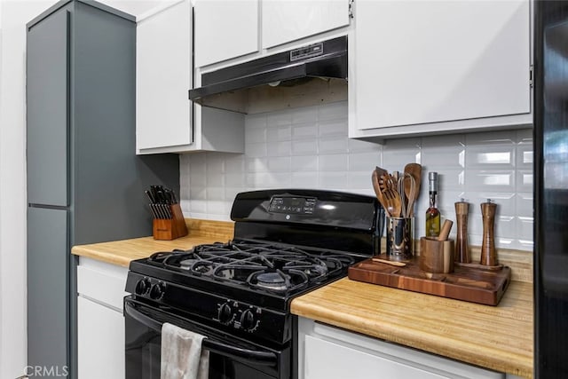 kitchen featuring white cabinetry, black appliances, and decorative backsplash