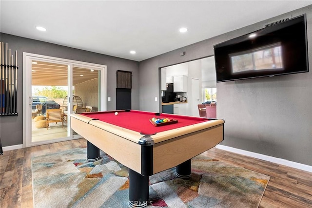 rec room with wood-type flooring, pool table, and a healthy amount of sunlight