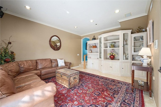 living room with light tile patterned floors and ornamental molding