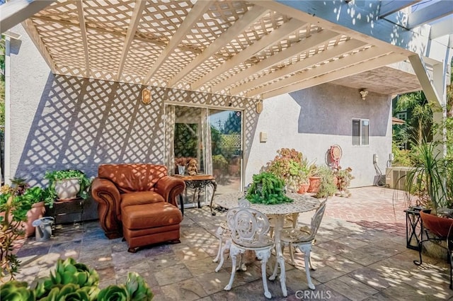 view of patio with central AC unit and a pergola