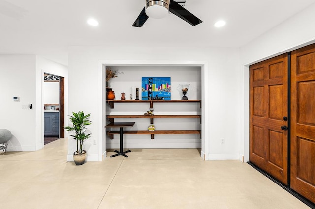 interior space featuring ceiling fan