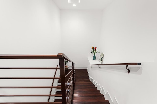 stairs featuring wood-type flooring