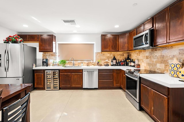 kitchen with decorative backsplash, stainless steel appliances, wine cooler, and sink