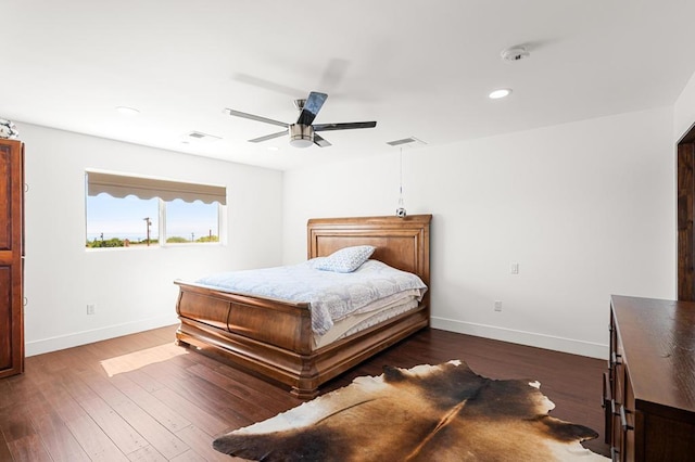 bedroom featuring ceiling fan and dark wood-type flooring