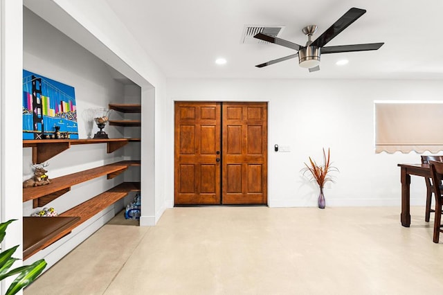 interior space with ceiling fan