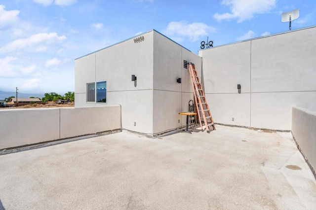 view of property exterior featuring a patio