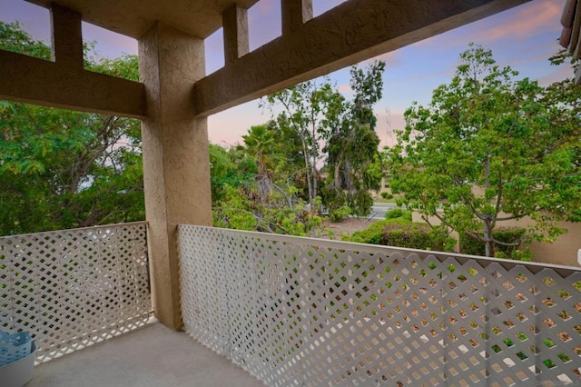 view of balcony at dusk