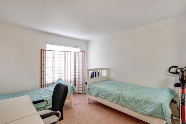 bedroom featuring light colored carpet