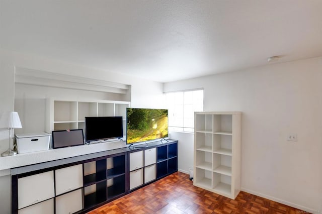 living room featuring dark parquet flooring