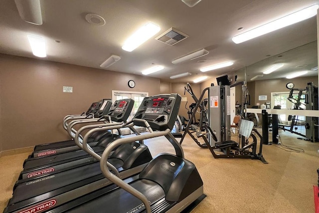 exercise room with light carpet