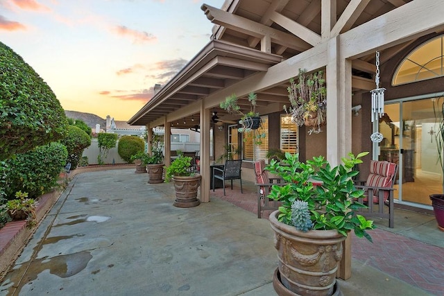 view of patio terrace at dusk