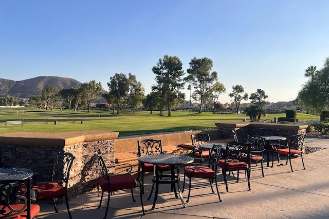 view of patio / terrace featuring a mountain view