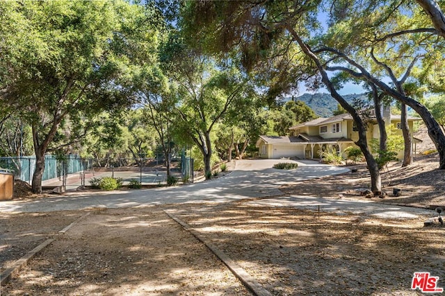 view of front of house featuring a garage and a mountain view