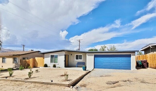 single story home featuring a garage