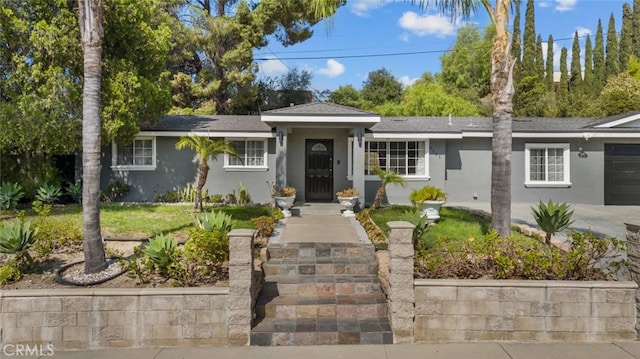 single story home featuring a garage