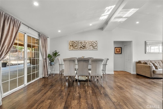 dining room featuring lofted ceiling with beams and dark wood-type flooring