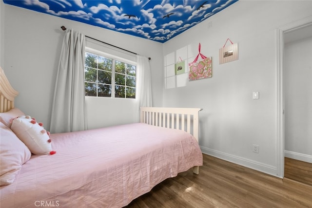 bedroom featuring wood-type flooring