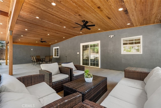 living room with ceiling fan and wood ceiling