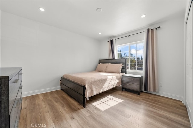 bedroom with light wood-type flooring