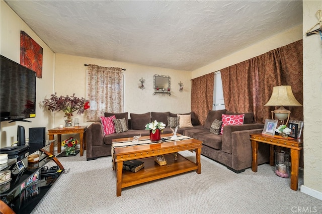 carpeted living room featuring a textured ceiling