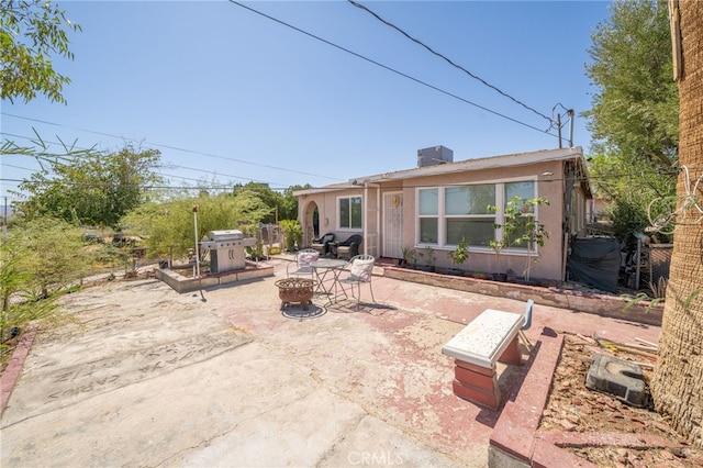 exterior space featuring a fire pit