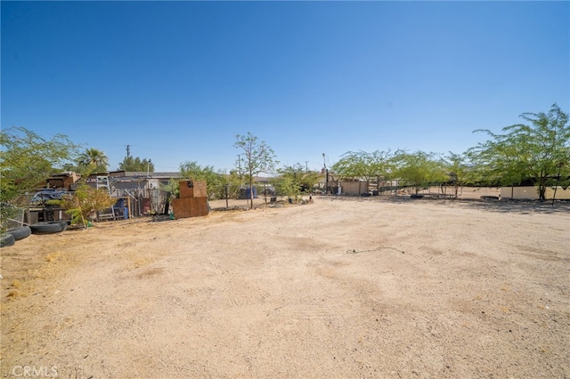 view of yard with a rural view