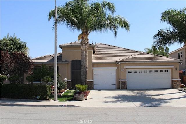 view of front of property with a garage