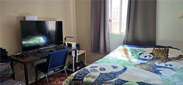 bedroom featuring dark parquet flooring