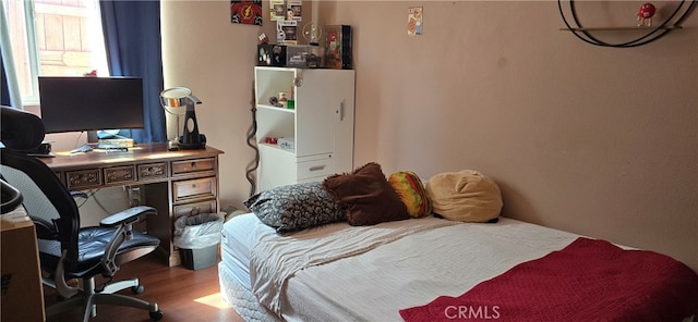 bedroom featuring hardwood / wood-style floors