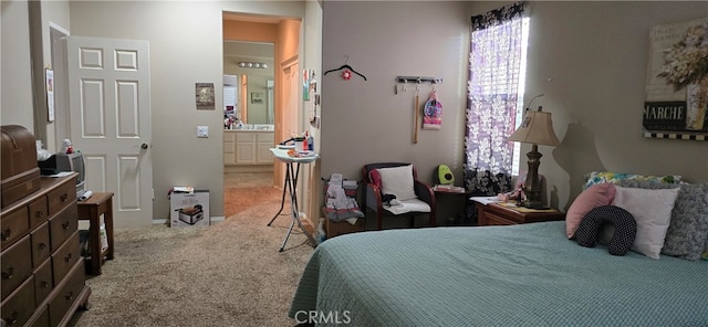 bedroom featuring carpet and ensuite bath