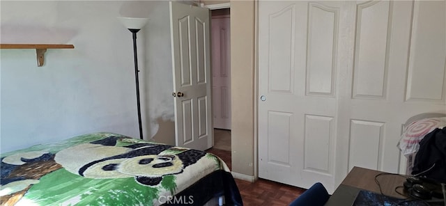 bedroom with dark parquet flooring