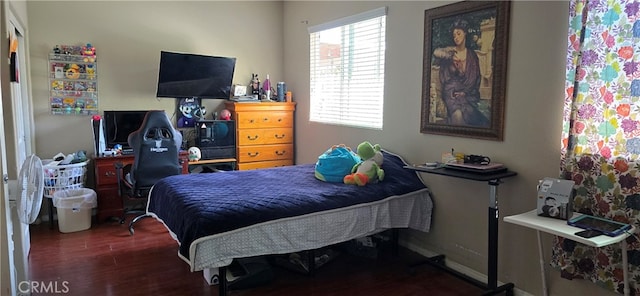 bedroom featuring dark hardwood / wood-style flooring