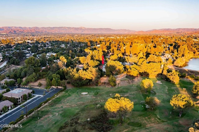 aerial view at dusk featuring a mountain view