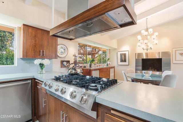 kitchen featuring an inviting chandelier, lofted ceiling with beams, custom range hood, pendant lighting, and stainless steel appliances