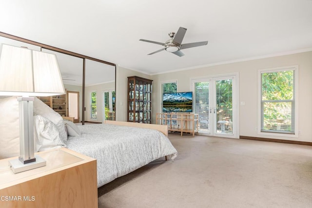 bedroom featuring carpet floors, multiple windows, access to outside, and ornamental molding