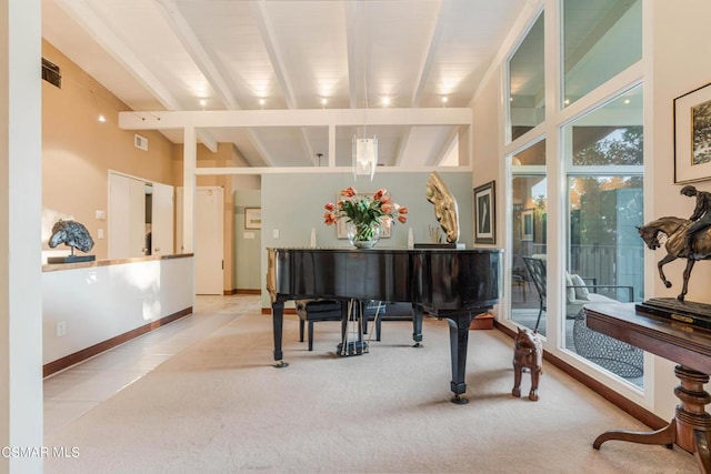 miscellaneous room featuring vaulted ceiling with beams and light carpet