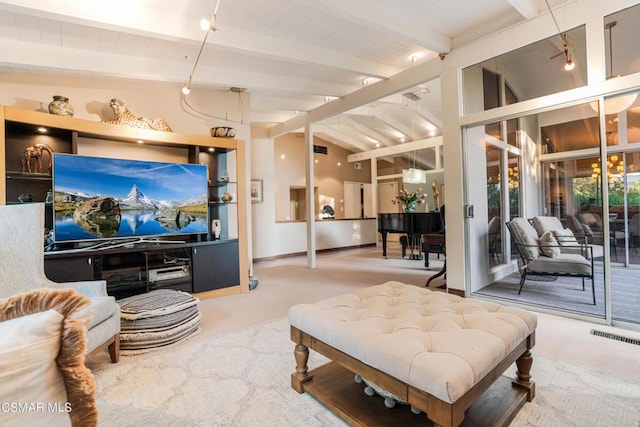 carpeted living room with vaulted ceiling with beams