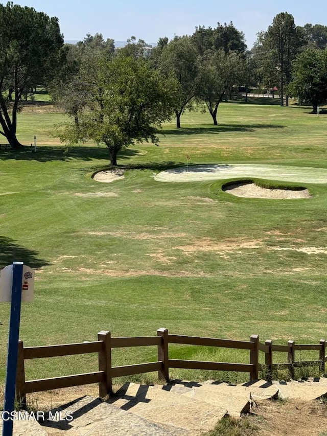 surrounding community featuring a lawn