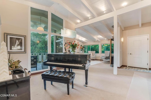 miscellaneous room with lofted ceiling with beams and light carpet