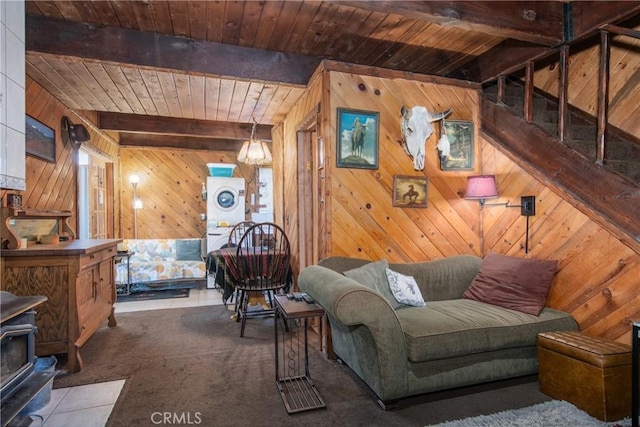 living room featuring wood ceiling, beam ceiling, wood walls, and carpet