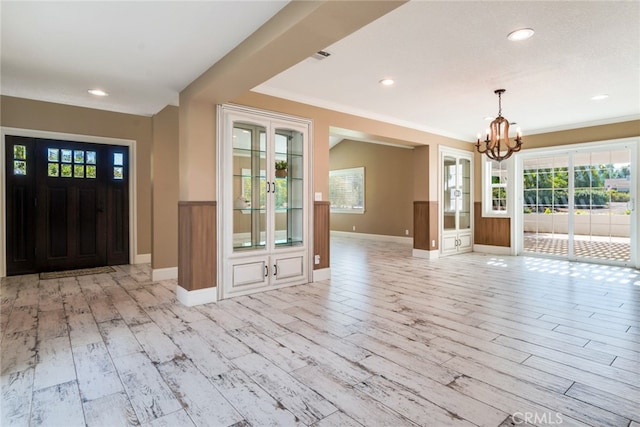 interior space featuring light hardwood / wood-style flooring and a chandelier