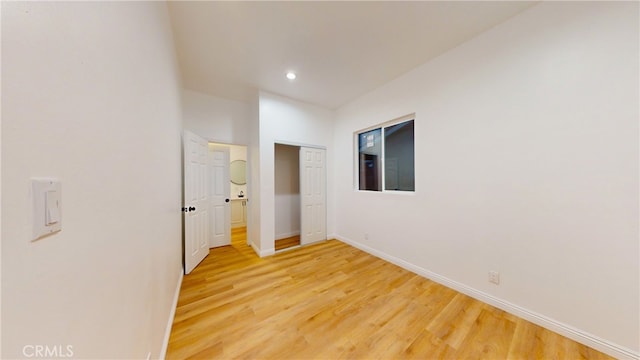 corridor featuring hardwood / wood-style flooring