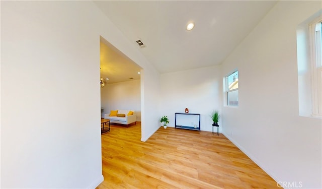 hallway with light hardwood / wood-style flooring