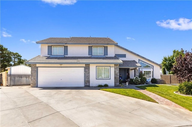 front facade with a garage and a front lawn