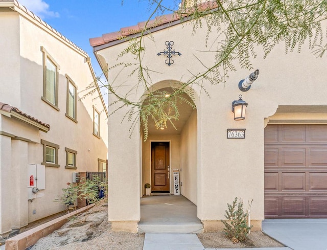 entrance to property featuring a garage