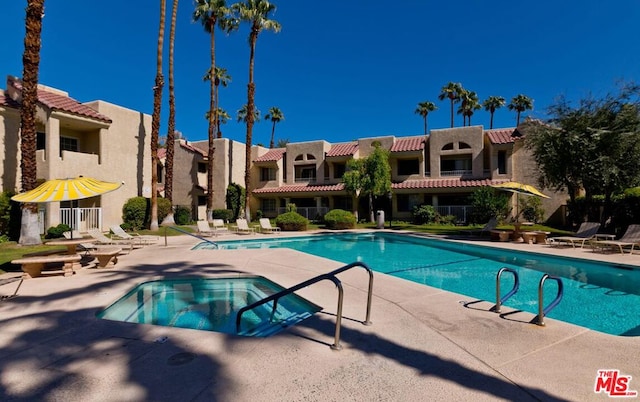 view of swimming pool with a patio