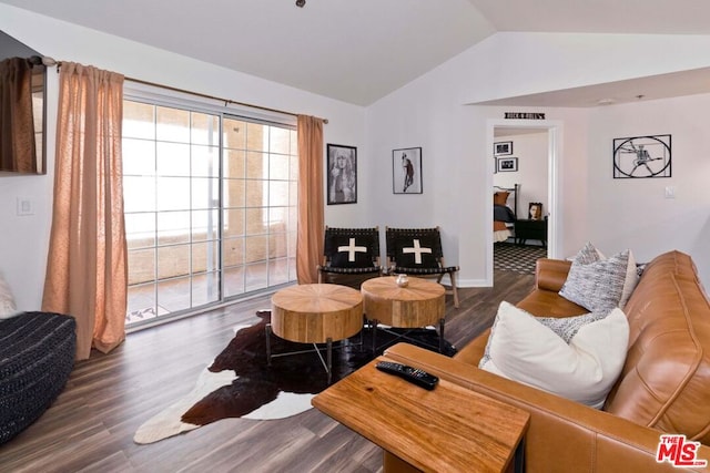 living room featuring dark hardwood / wood-style floors and lofted ceiling