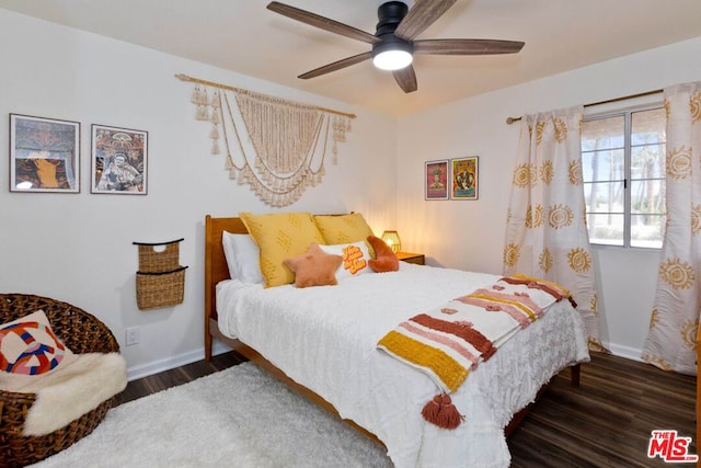 bedroom featuring ceiling fan and dark hardwood / wood-style flooring